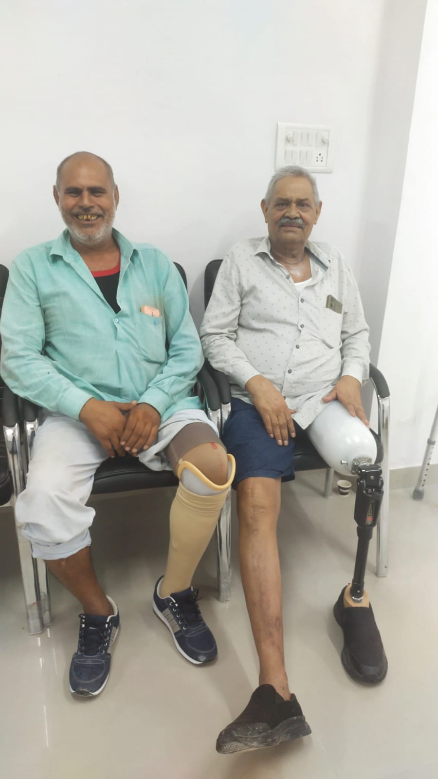 Patient testing a custom lightweight below-knee prosthetic for comfortable daily walking